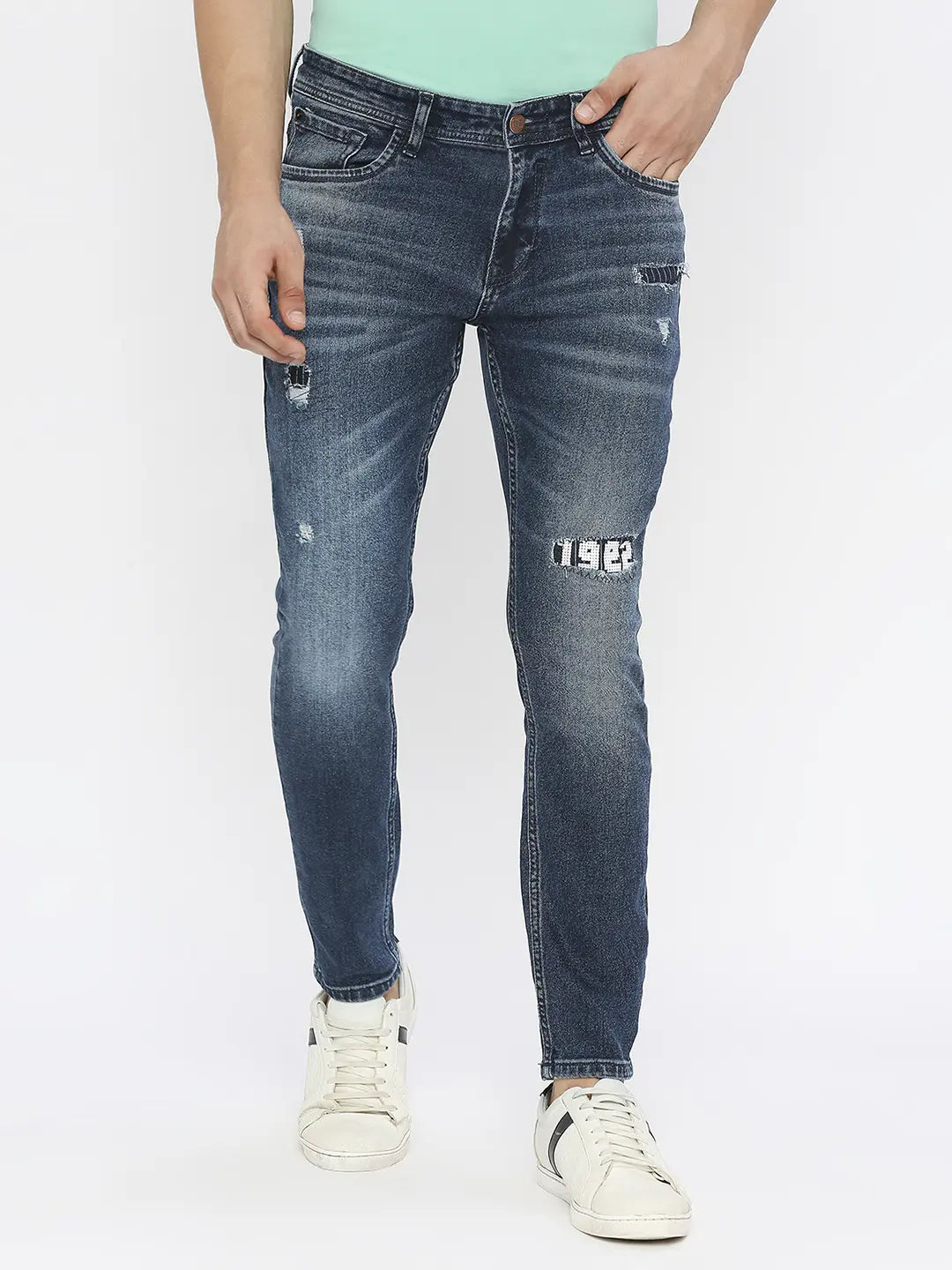 Holiday Jeans for Festive -Spykar Men Dark Blue Cotton Slim Fit Tapered Length Mildly Distressed Mid Rise Jeans-(Kano)